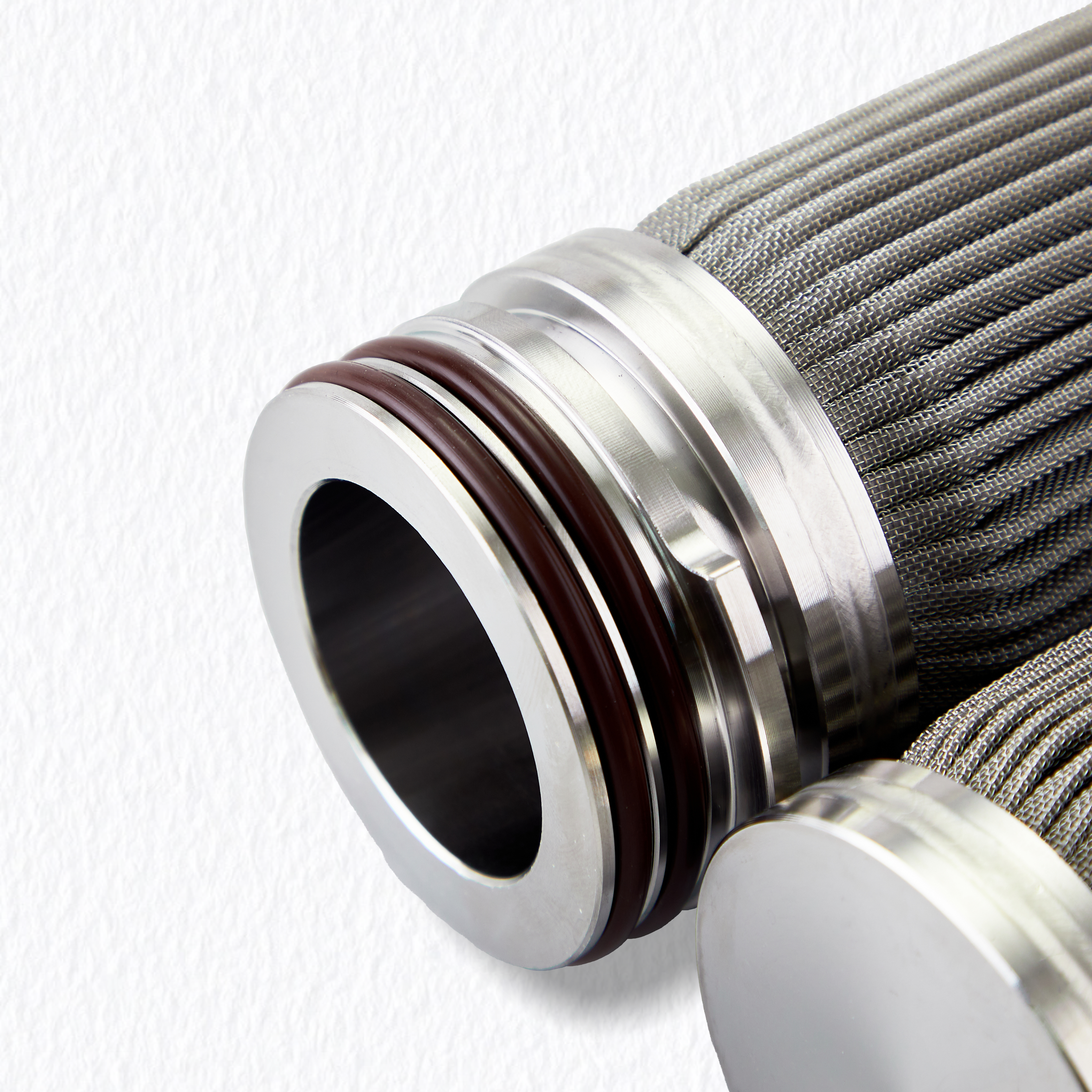 Close-up of stainless steel filter cartridge open end cap featuring high-temperature resistant double O-ring seal (Code 222/226) for secure bypass-free filtration.